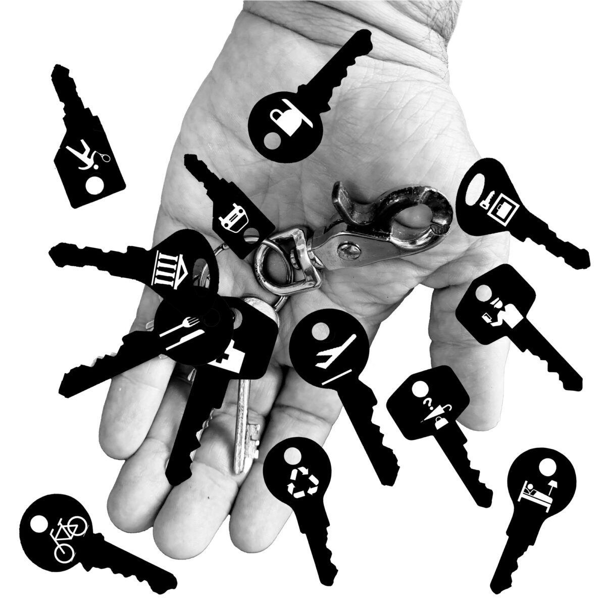 An open hand holds a bunch of keys